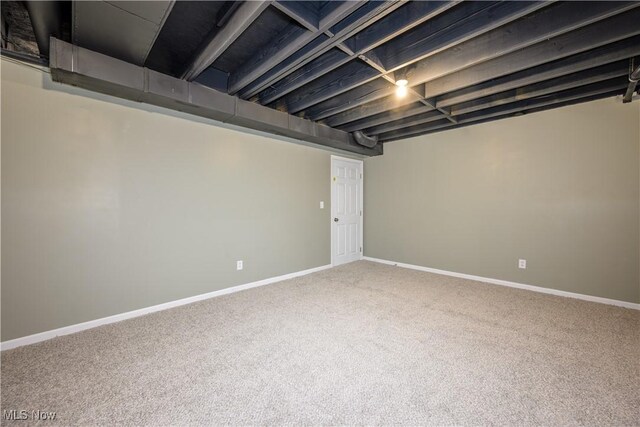 finished basement featuring carpet floors and baseboards