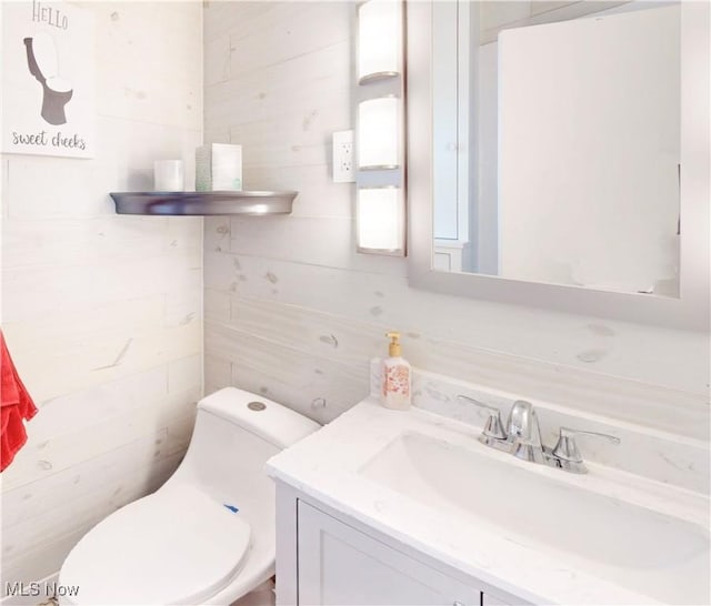 bathroom with toilet and vanity