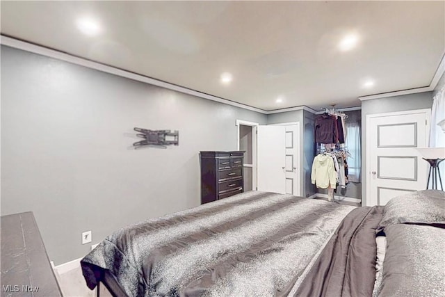 bedroom with baseboards, ornamental molding, and recessed lighting