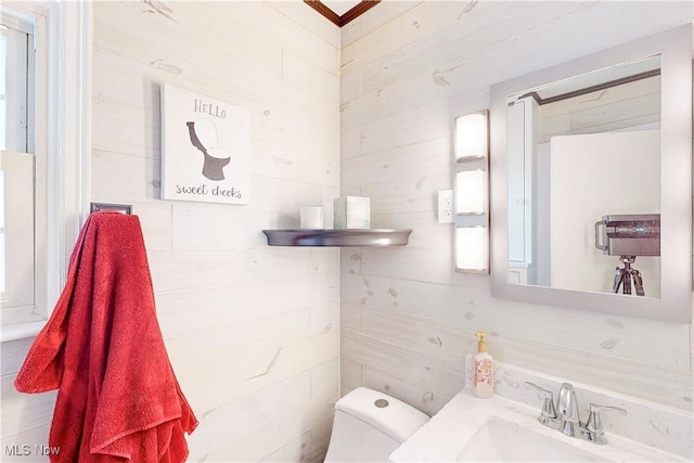 half bathroom with a sink and toilet