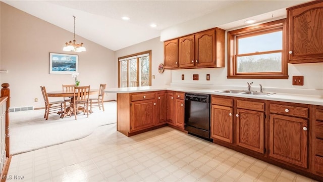 kitchen with black dishwasher, a sink, visible vents, and a wealth of natural light