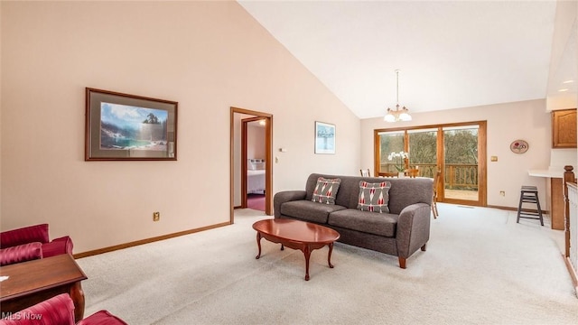 living room with baseboards, high vaulted ceiling, a chandelier, and light carpet