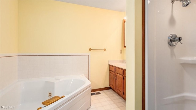bathroom with vanity, a stall shower, tile patterned floors, visible vents, and a tub with jets