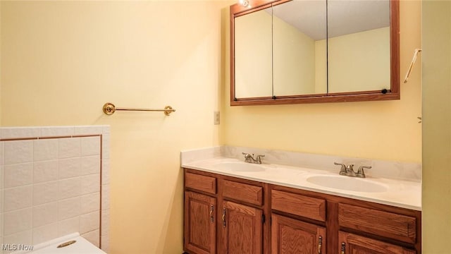 full bath featuring double vanity and a sink