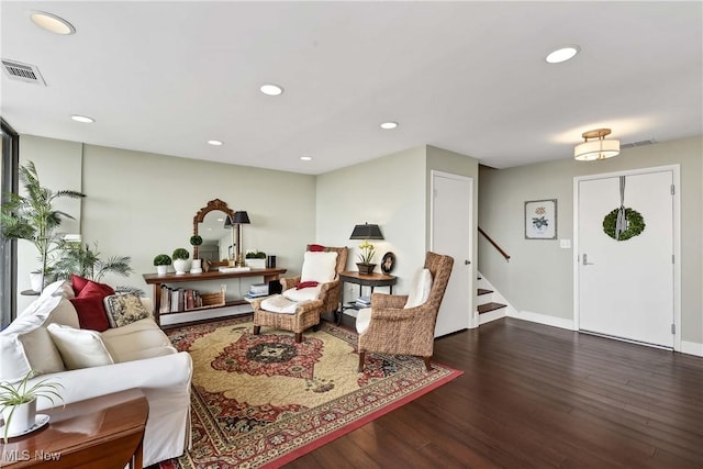 living room featuring visible vents, recessed lighting, wood finished floors, and stairs