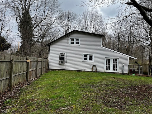back of property with a yard, french doors, fence, and cooling unit