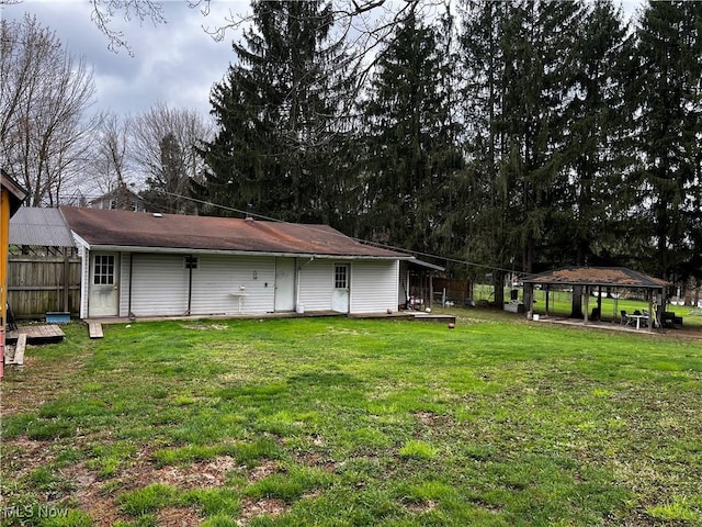 view of yard featuring a gazebo and fence