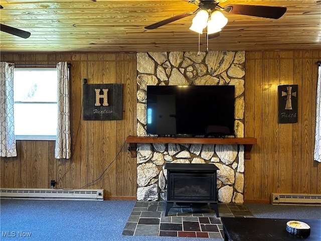 3265 Tieber Rd, Stockport, OH 43787 - carpeted living room with a baseboard radiator, wood ceiling, a ceiling fan, and wooden walls