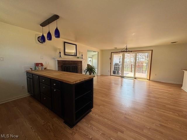 152 Oneida Trl, Malvern, OH 44644 - office with baseboards, wood finished floors, and a brick fireplace