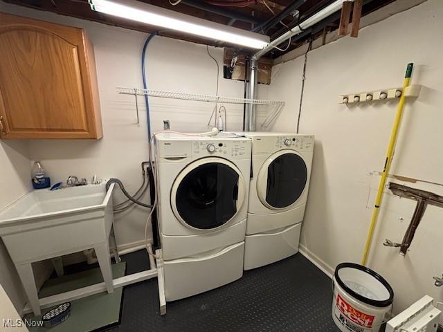 152 Oneida Trl, Malvern, OH 44644 - laundry room with dark colored carpet, independent washer and dryer, and cabinet space