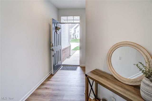 850-4 Dipper Ln, Aurora, OH 44202 - entryway with baseboards and wood finished floors