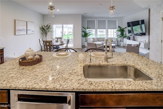 850-4 Dipper Ln, Aurora, OH 44202 - kitchen with a sink, open floor plan, and light stone countertops