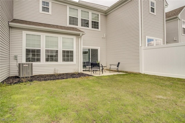 850-4 Dipper Ln, Aurora, OH 44202 - rear view of house with central air condition unit, a patio, fence, and a lawn