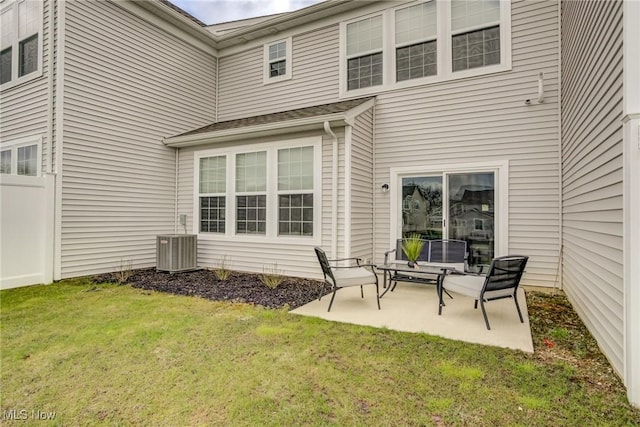 850-4 Dipper Ln, Aurora, OH 44202 - back of property with central air condition unit, a yard, and a patio area