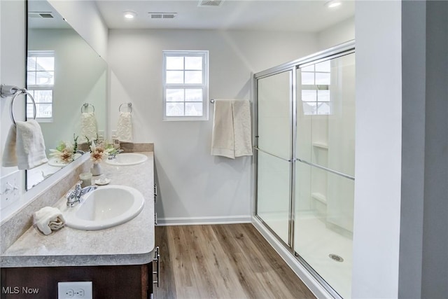 850-4 Dipper Ln, Aurora, OH 44202 - bathroom featuring a sink, a shower stall, and a healthy amount of sunlight