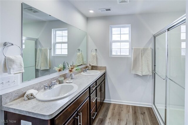 850-4 Dipper Ln, Aurora, OH 44202 - full bath featuring a sink, a stall shower, and wood finished floors