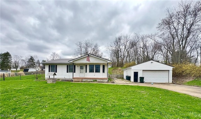 view of front facade with a front lawn, a garage, fence, and an outdoor structure