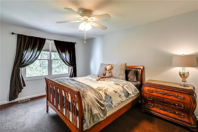 bedroom with visible vents, baseboards, a ceiling fan, and carpet floors
