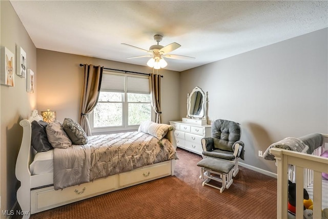 carpeted bedroom featuring ceiling fan and baseboards