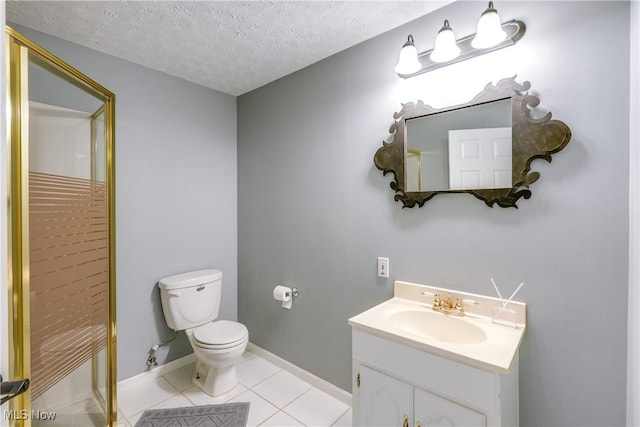 bathroom with baseboards, toilet, a textured ceiling, vanity, and tile patterned floors