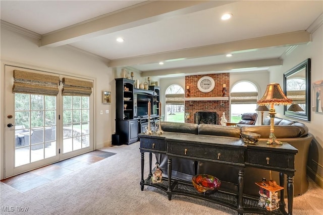 carpeted living room with crown molding, beamed ceiling, a fireplace, recessed lighting, and baseboards