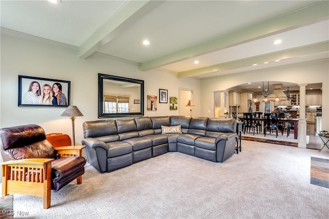 living area with decorative columns, recessed lighting, beam ceiling, and carpet floors