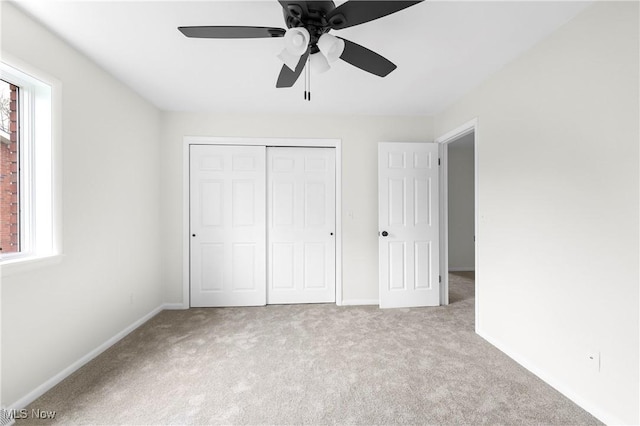 105 Garfield Way, Follansbee, WV 26037 - unfurnished bedroom featuring a closet, baseboards, multiple windows, and carpet floors