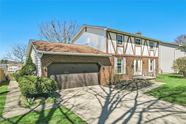2262 Tanglewood Dr, Salem, OH 44460 - back of property featuring brick siding, an attached garage, driveway, and a chimney
