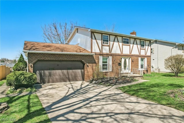 2262 Tanglewood Dr, Salem, OH 44460 - view of front of house with brick siding, a garage, concrete driveway, and a chimney