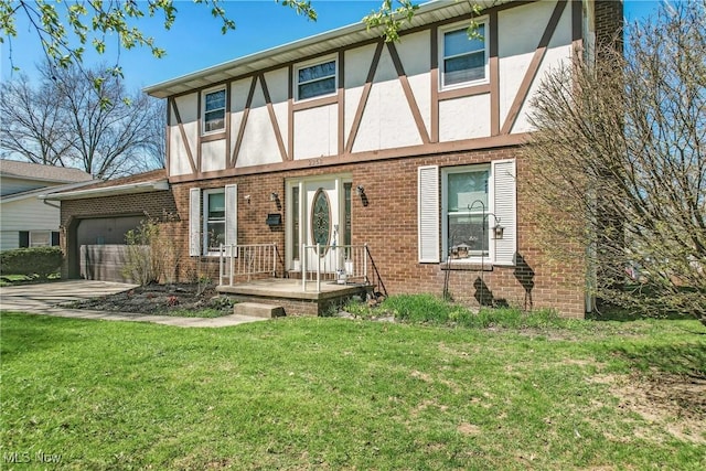 2262 Tanglewood Dr, Salem, OH 44460 - tudor house featuring stucco siding, a garage, brick siding, and a front yard