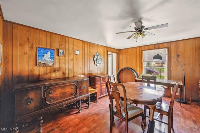 2262 Tanglewood Dr, Salem, OH 44460 - dining room featuring wood finished floors, ceiling fan, and wood walls