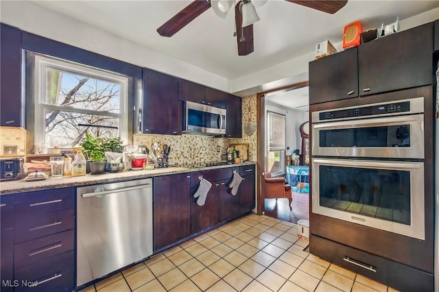 2262 Tanglewood Dr, Salem, OH 44460 - kitchen with stainless steel appliances, decorative backsplash, healthy amount of natural light, and a ceiling fan