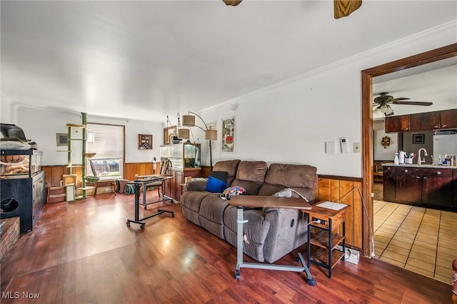 2262 Tanglewood Dr, Salem, OH 44460 - living room featuring a wainscoted wall, a ceiling fan, wood finished floors, and wooden walls
