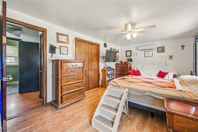 2262 Tanglewood Dr, Salem, OH 44460 - bedroom featuring an AC wall unit, light wood finished floors, and ceiling fan