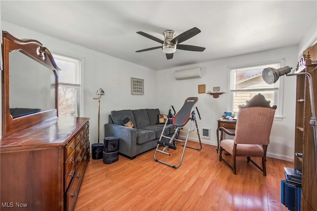 2262 Tanglewood Dr, Salem, OH 44460 - living area with a wall mounted AC, plenty of natural light, ceiling fan, and light wood-style floors