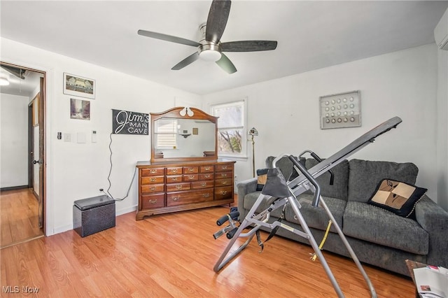 2262 Tanglewood Dr, Salem, OH 44460 - exercise area featuring a ceiling fan, light wood finished floors, and an AC wall unit