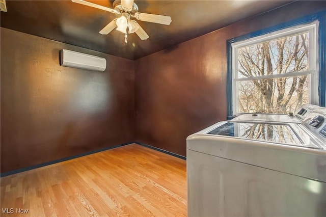 2262 Tanglewood Dr, Salem, OH 44460 - empty room featuring washer and clothes dryer, a wall mounted AC, light wood-style flooring, and ceiling fan