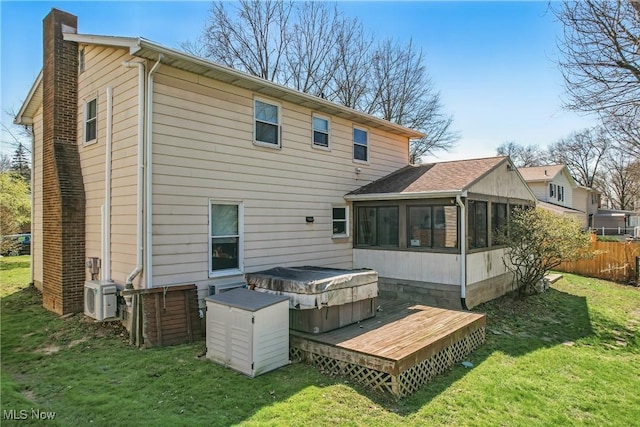 2262 Tanglewood Dr, Salem, OH 44460 - back of house featuring a chimney, a hot tub, a sunroom, and a wooden deck