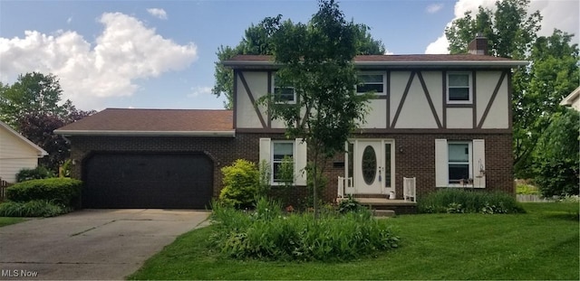 2262 Tanglewood Dr, Salem, OH 44460 - english style home featuring brick siding, a garage, a chimney, and concrete driveway