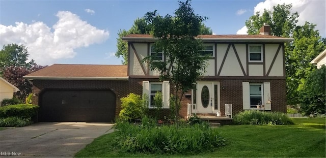 2262 Tanglewood Dr, Salem, OH 44460 - english style home featuring brick siding, a garage, stucco siding, and driveway