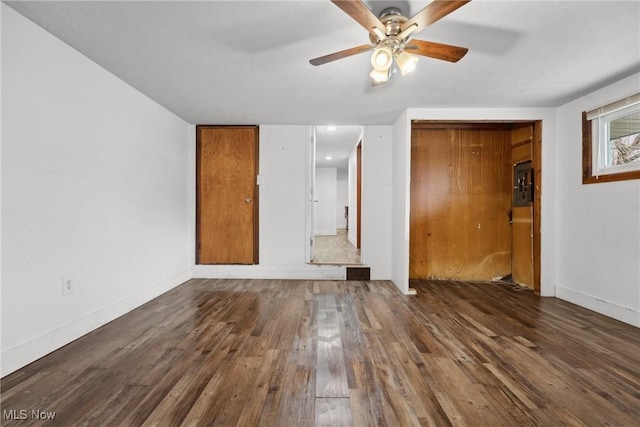 unfurnished bedroom with baseboards, a ceiling fan, and wood finished floors