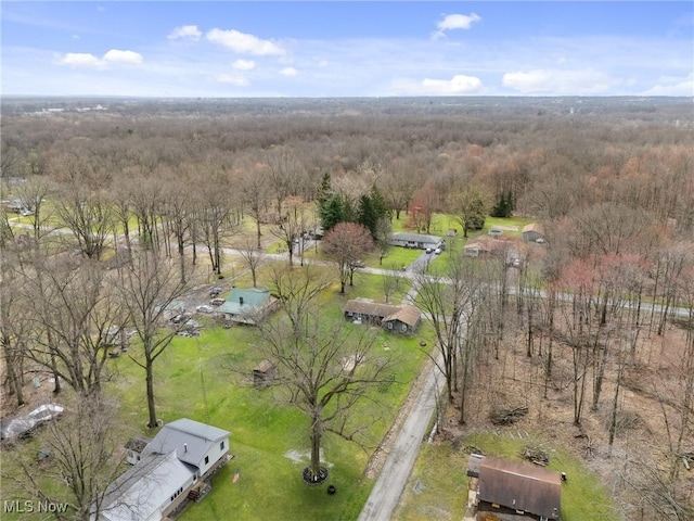 bird's eye view featuring a wooded view