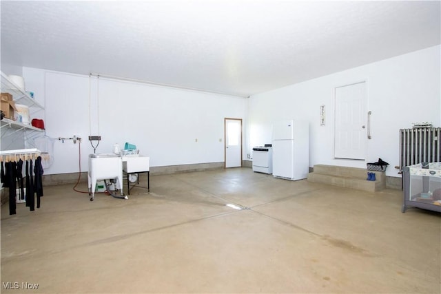 garage featuring freestanding refrigerator