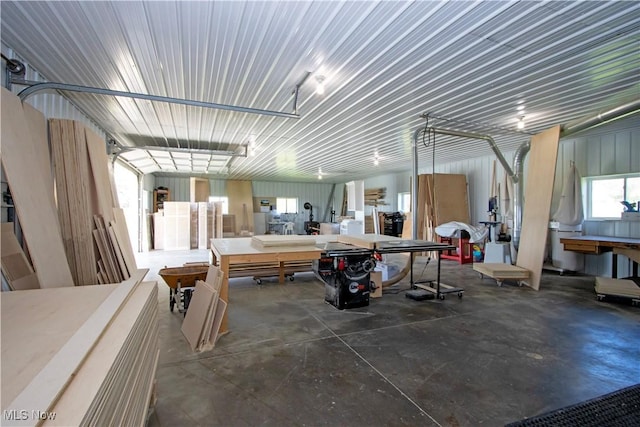 miscellaneous room featuring concrete floors and a garage