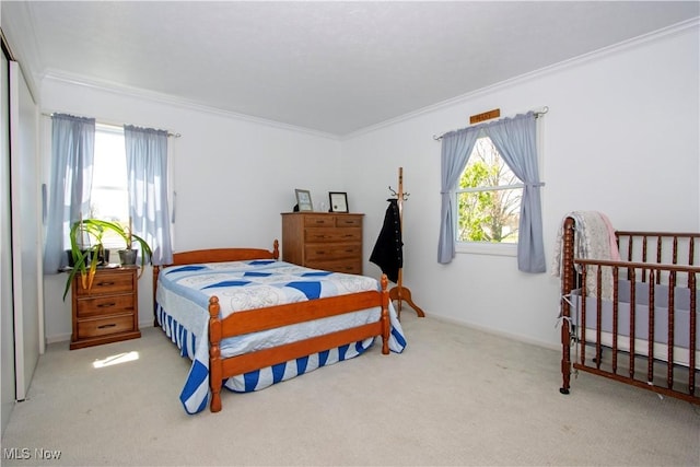carpeted bedroom featuring crown molding