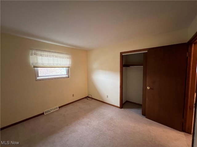 260 Scenery Dr, Weirton, WV 26062 - unfurnished bedroom featuring a closet, visible vents, light colored carpet, and baseboards
