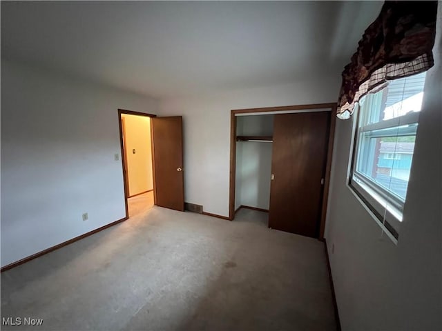 260 Scenery Dr, Weirton, WV 26062 - unfurnished bedroom with light carpet, a closet, and baseboards