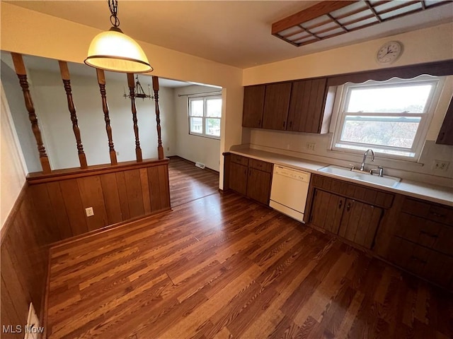 260 Scenery Dr, Weirton, WV 26062 - kitchen with dark wood-style floors, light countertops, white dishwasher, a sink, and hanging light fixtures