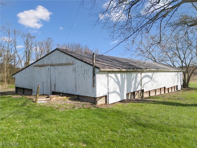 5706 Kemary Ave SW, Navarre, OH 44662 - view of side of home with a yard, an outdoor structure, and a pole building