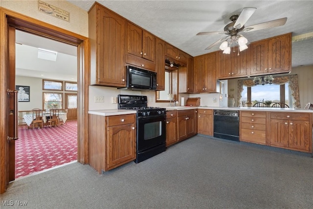 5706 Kemary Ave SW, Navarre, OH 44662 - kitchen with black appliances, light carpet, a sink, light countertops, and brown cabinets